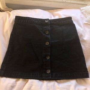 Medium black  denim miniskirt with from buttons
